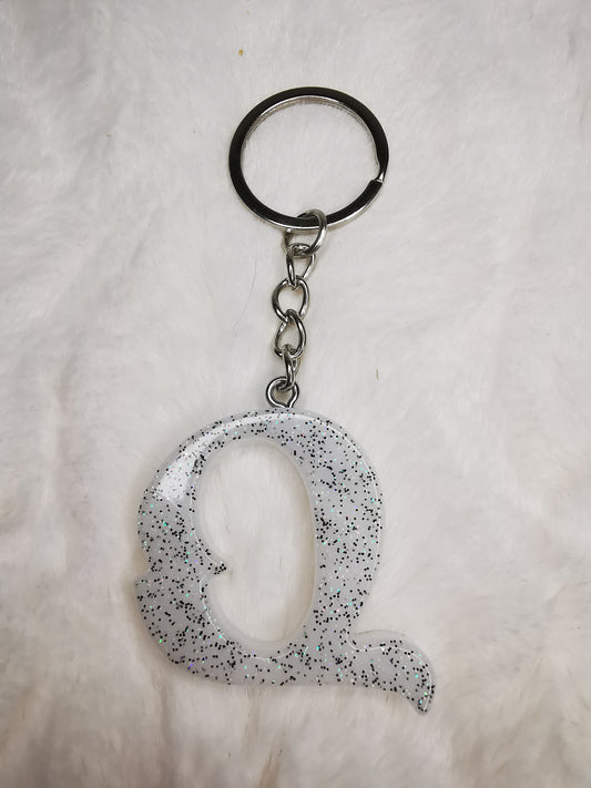 Porte clé lettre Q blanc pailletté noir