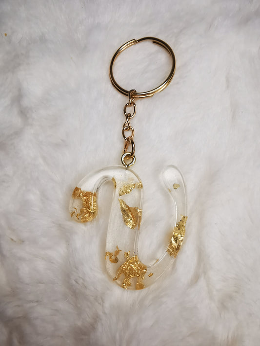 Porte clé lettre V blanc avec feuille d'or