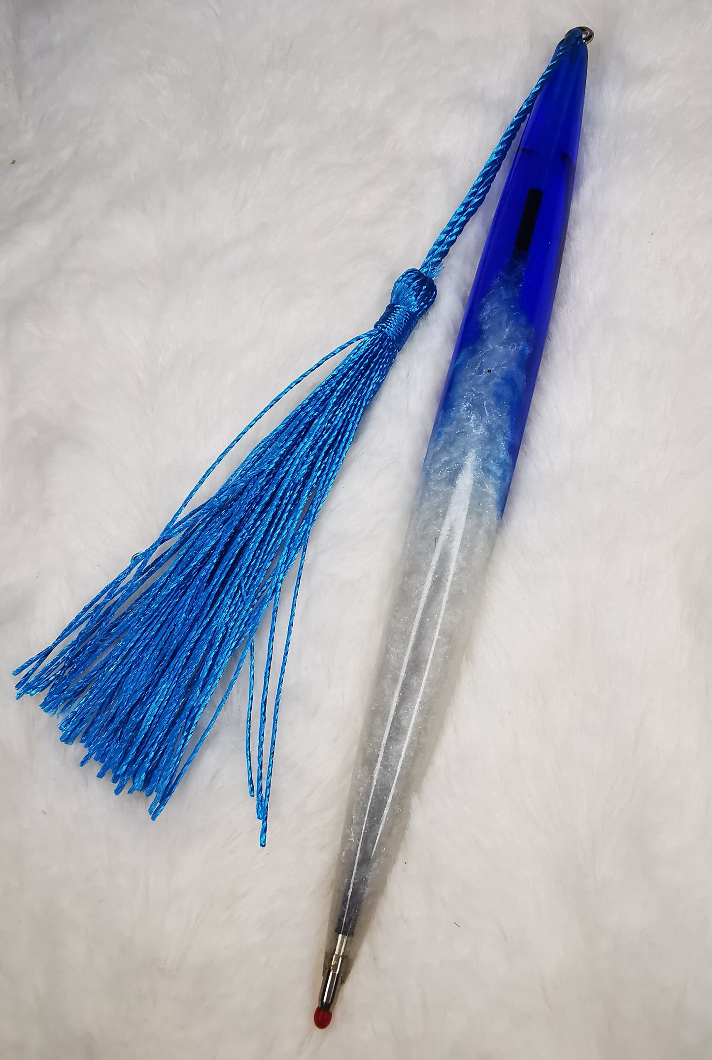 Stylo bleu et blanc avec son pompon