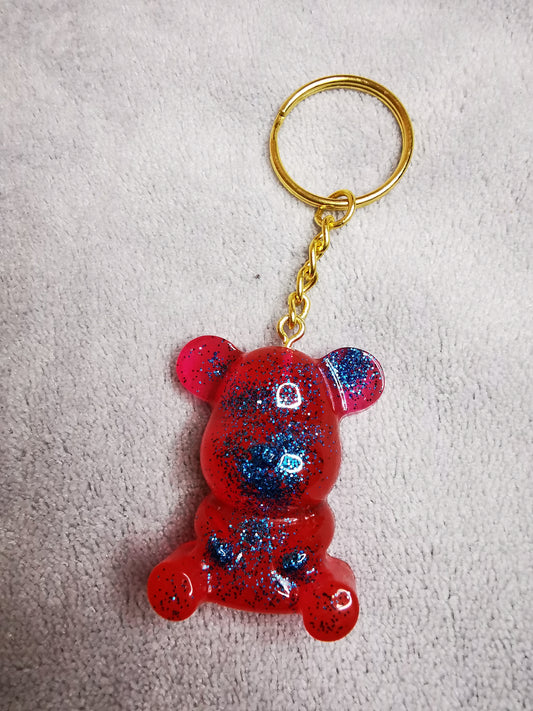 Porte clé ourson rouge/rose pailleté bleu