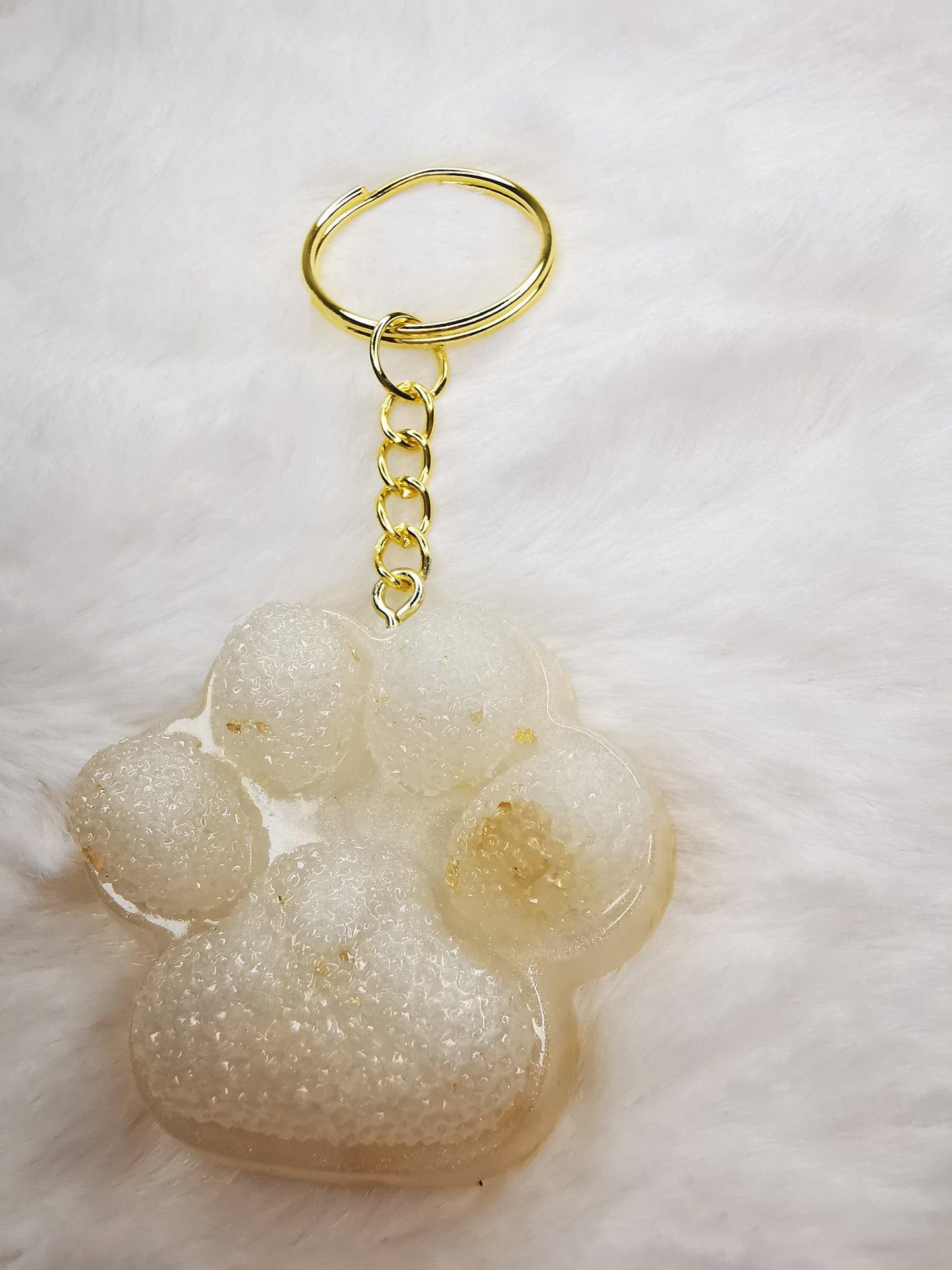 Porte clé patte de chien/chat blanc avec feuille d'or