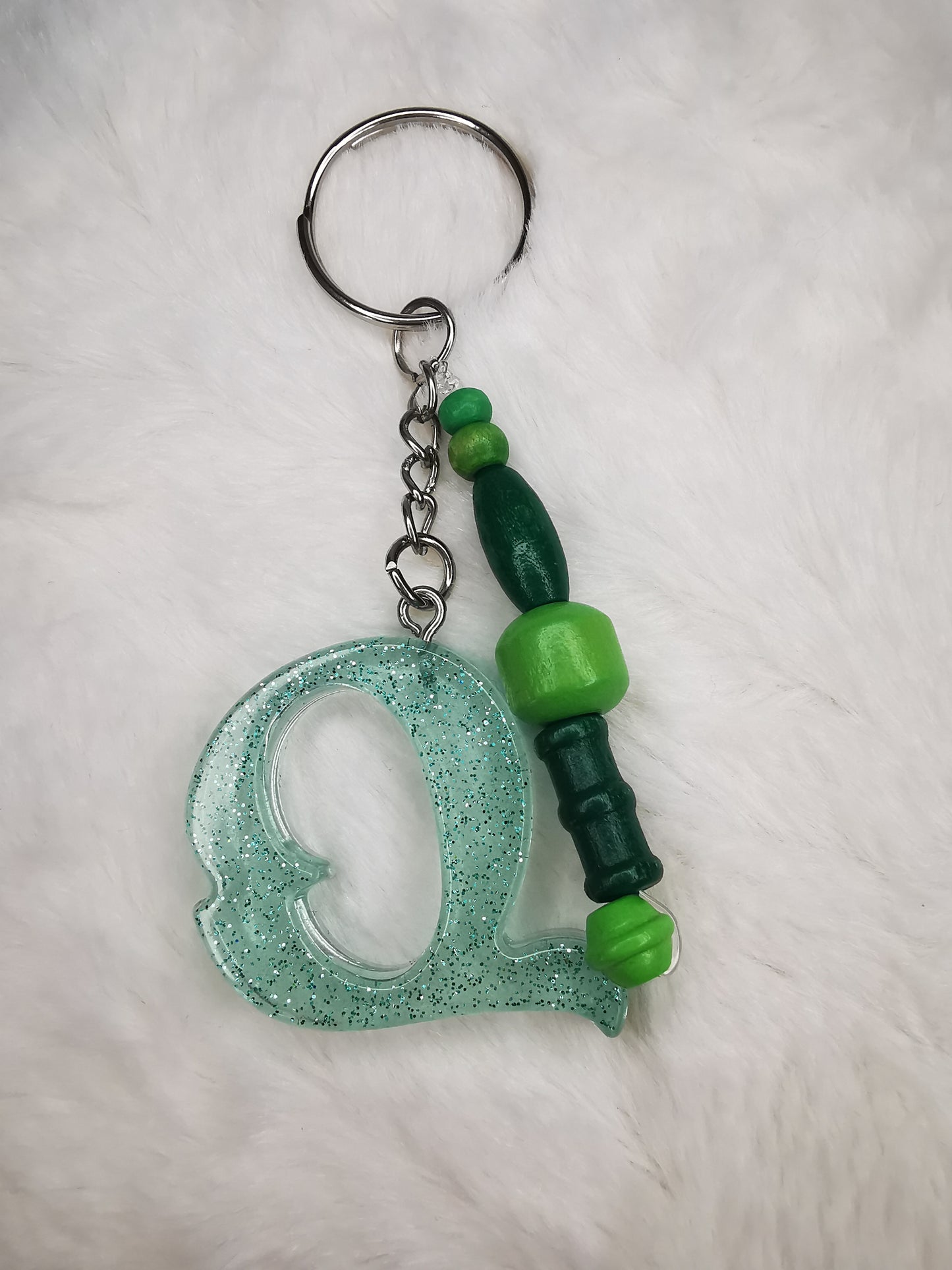 Porte clé lettre Q vert pailletté