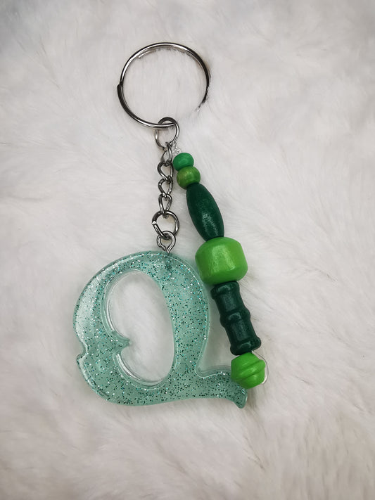 Porte clé lettre Q vert pailletté