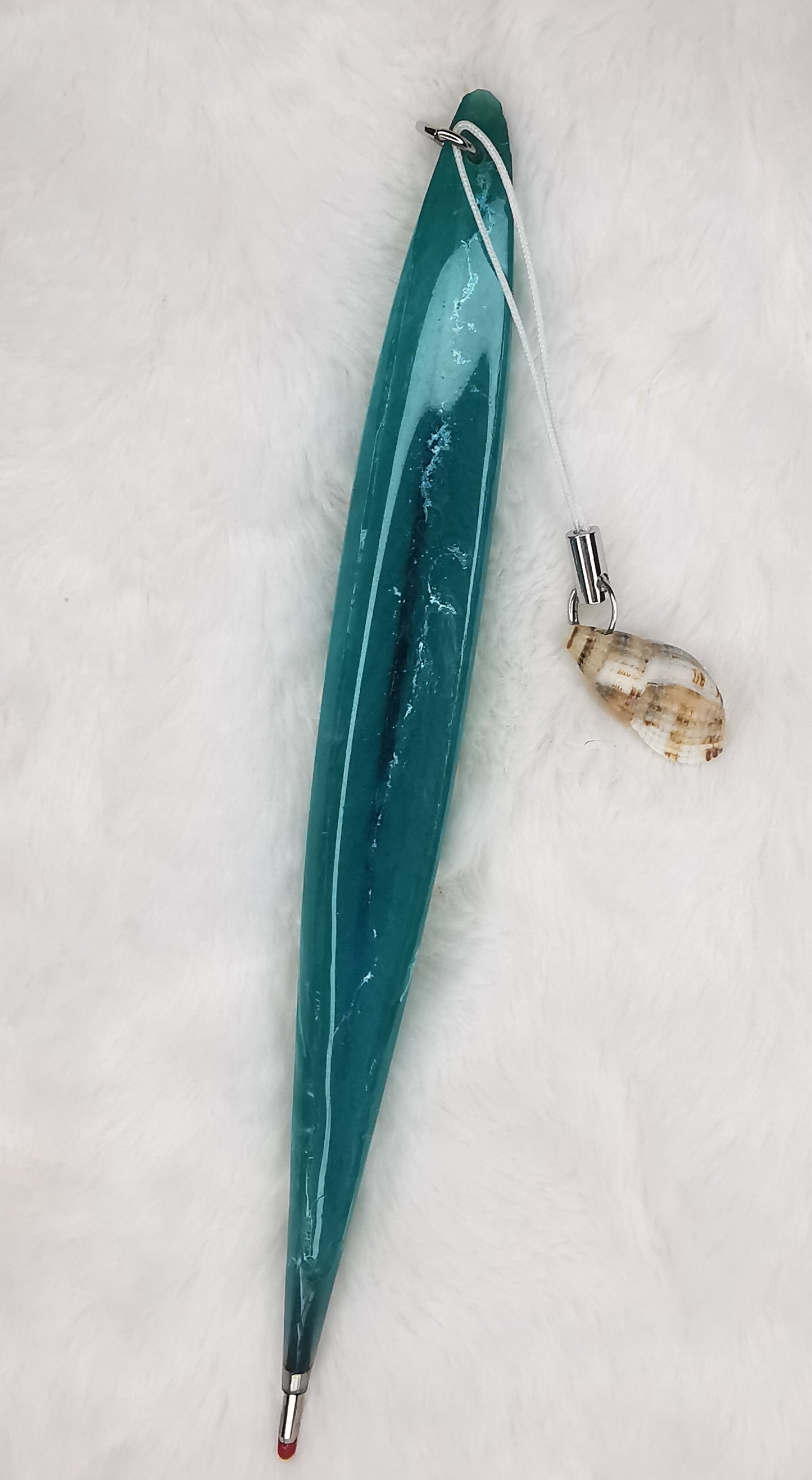 Stylo vert avec coquillage