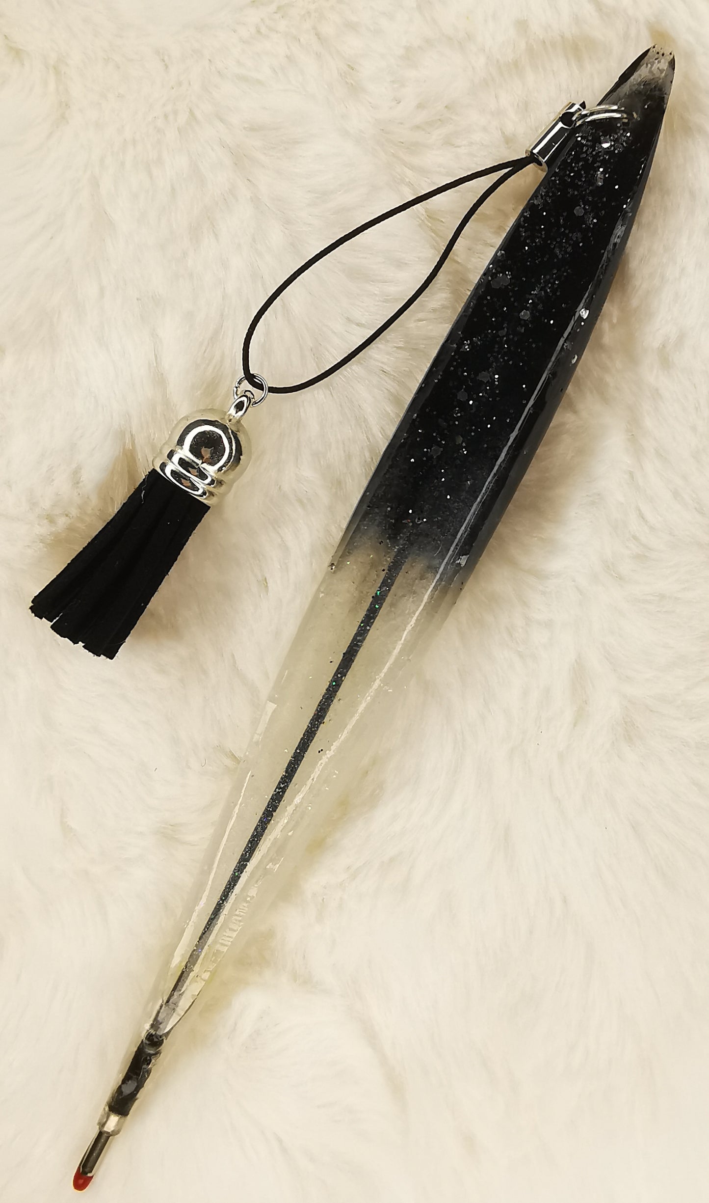 Stylo noir pailletté et blanc avec son pompon