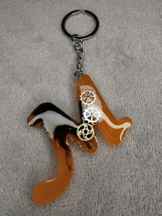 Porte clé lettre M avec engrenages