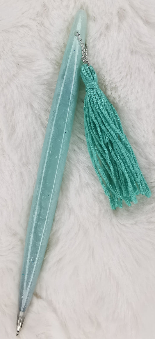 Stylo vert et son pompon